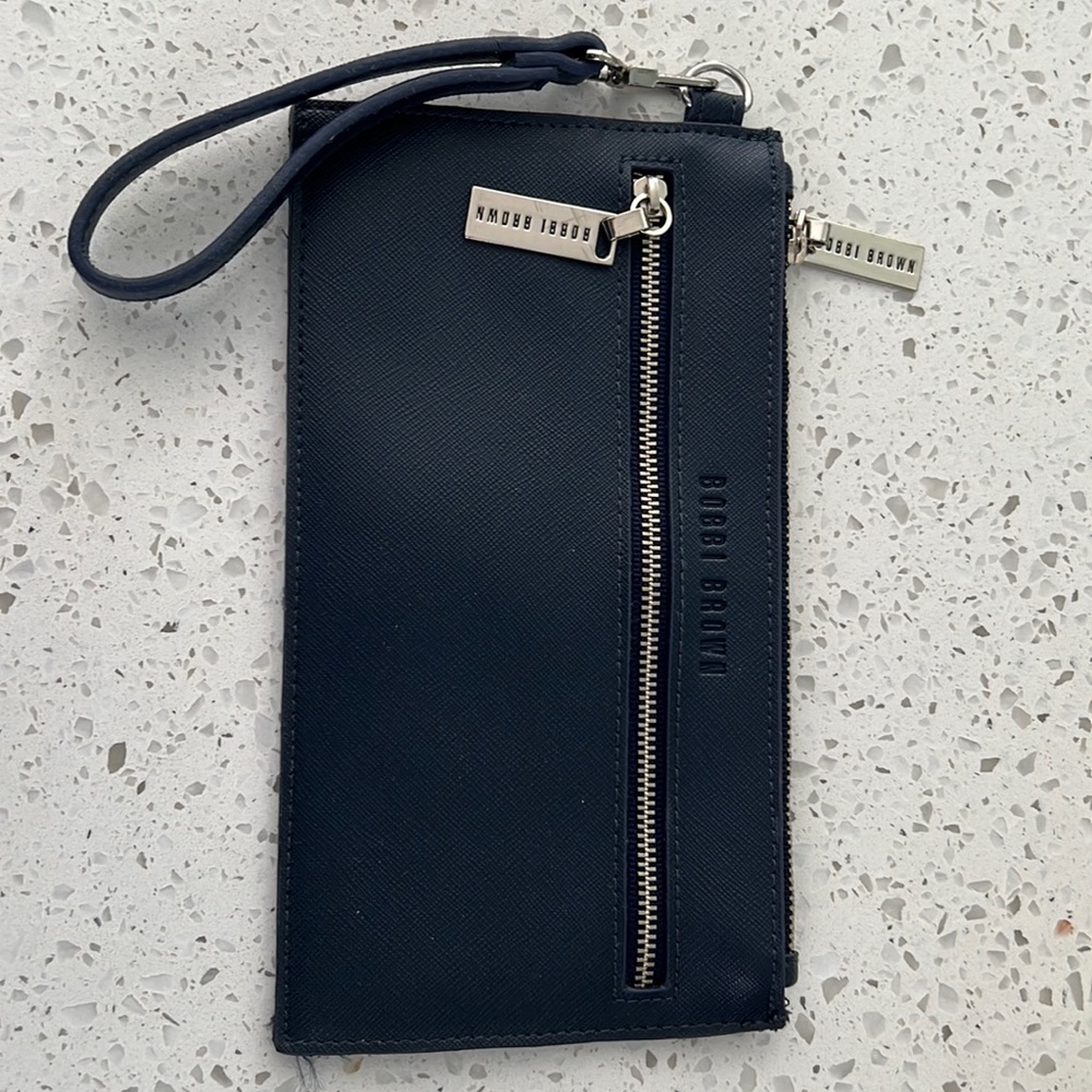 Bobbi Brown wristlet in Navy with removable strap.
